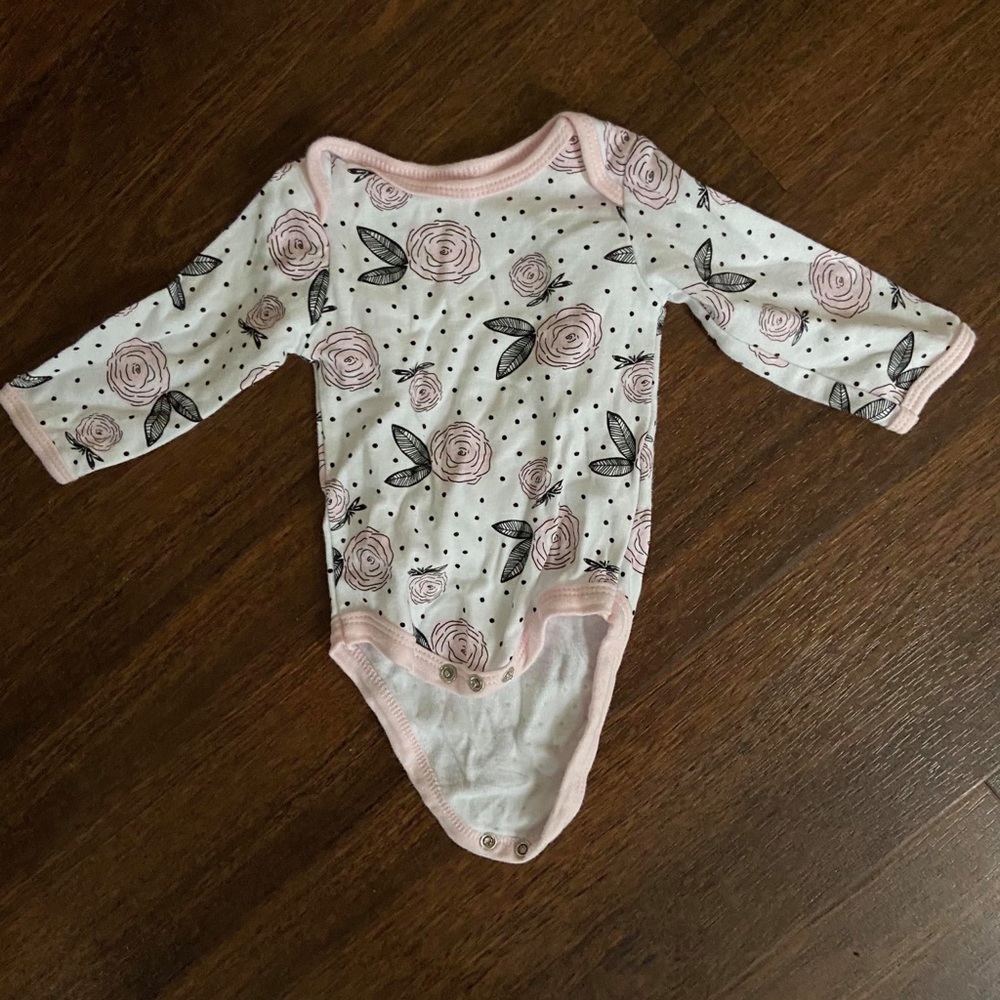 White floral print long sleeved onesie